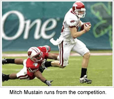 Mitch Mustain runs from the competition.