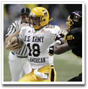 Jevan Snead runs past Myron Rolle in the Army All-American game