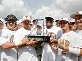The Texas baseball team holds the Big 12 Tourney trophy. (TexasSports.com)
