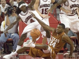 Without a true point guard, Justin Mason and the Horns have struggled this season.