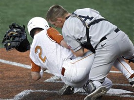 Travis Tucker attempts to slide into home against Army. (Statesman.com)